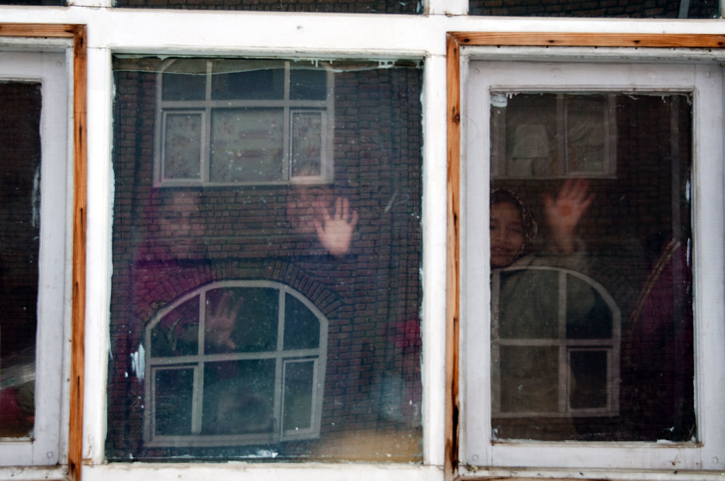 Kabul Refugee Children Welcome Winter Clothes From ISAF Volunteers